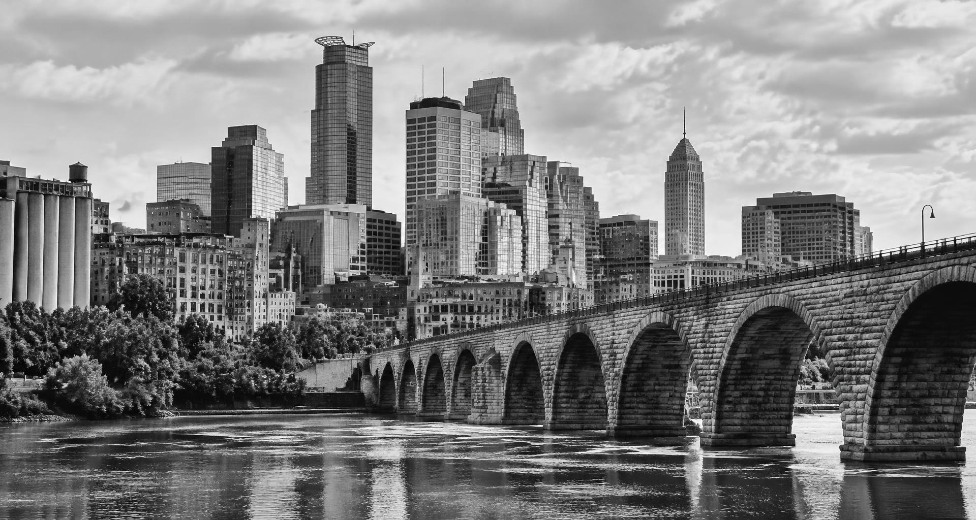 Black-and-white Minneapolis skyline and Stone Arch Bridge