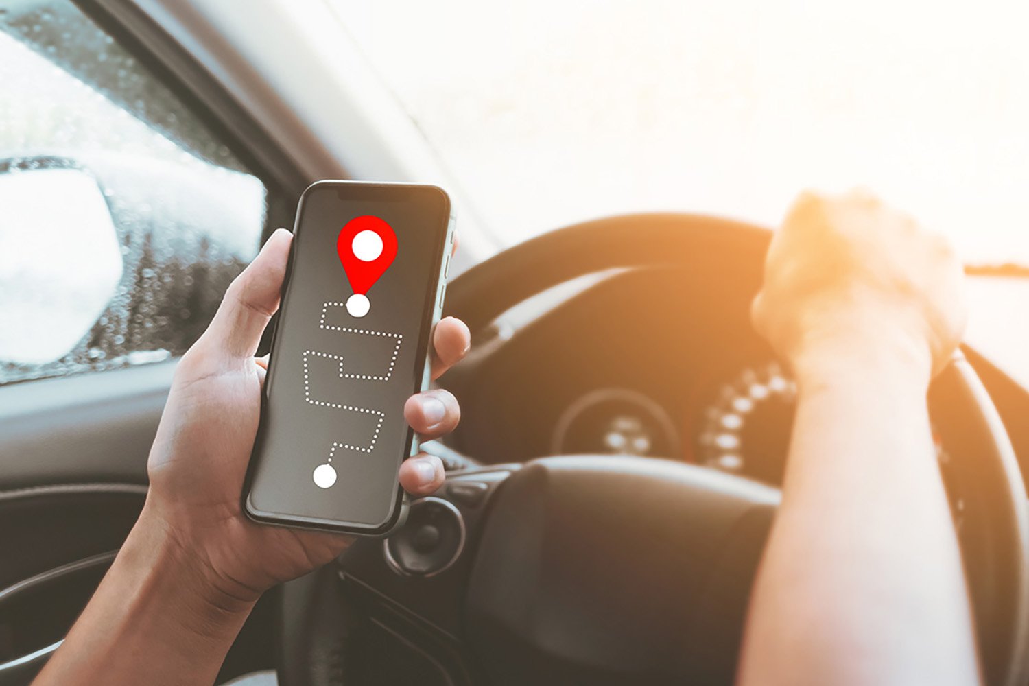 Person holding smartphone displaying navigation map with location pin, emphasizing location and accessibility for podcast studio selection.