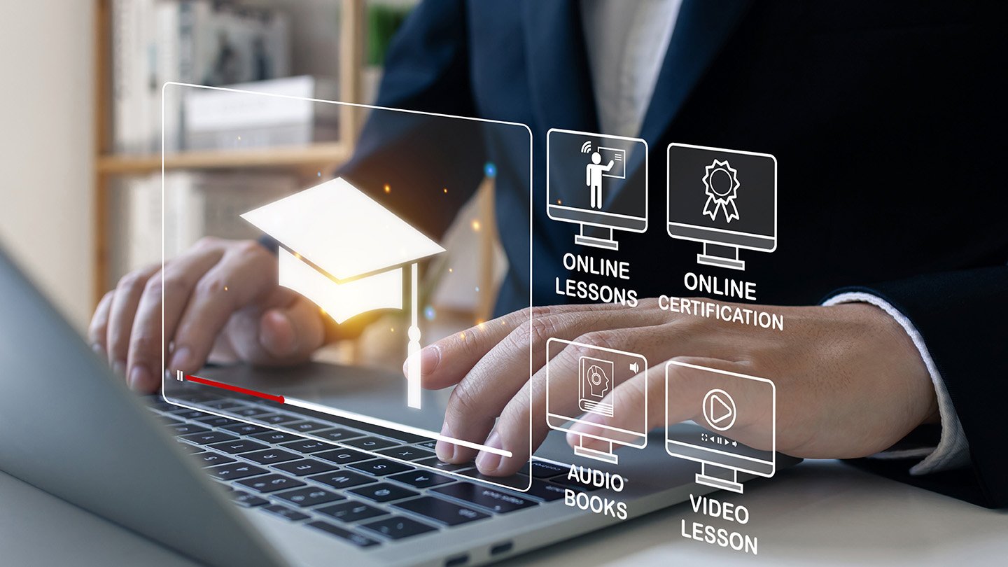 Person using a laptop with icons for online lessons, online certification, audio books, and video lessons, illustrating educational content and coaching opportunities for podcasters.